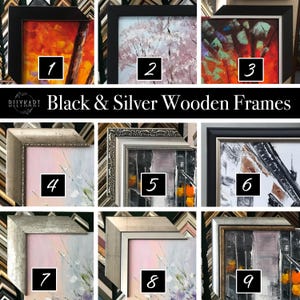May include: A collection of framed artwork with various styles and colors. The frames are black and silver wooden frames. The artwork includes abstract paintings with vibrant colors and landscapes. The text "Black & Silver Wooden Frames" is displayed.