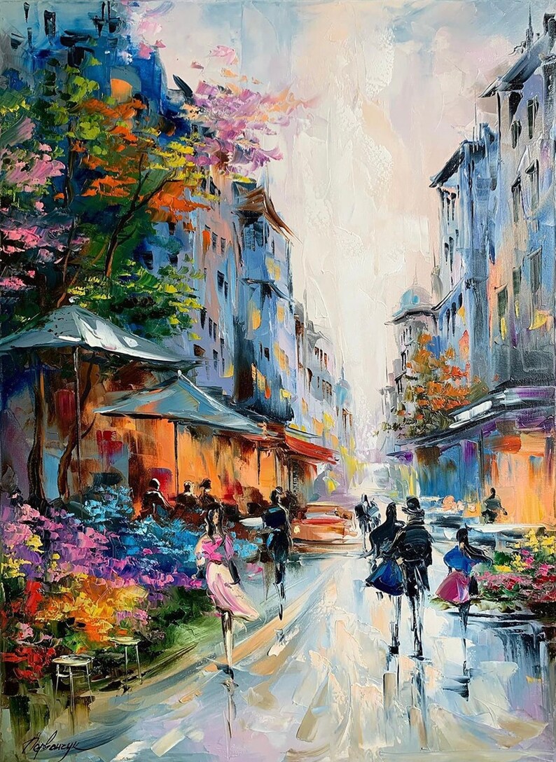 May include: A colorful oil painting depicting a street scene in a European city. The painting features a bustling street with people walking, a cafe with an awning, and a car driving down the street. The buildings on either side of the street are painted in shades of blue and gray, and the sky is a soft, pale blue. The painting is full of vibrant colors and details, and it captures the energy and charm of a European city.