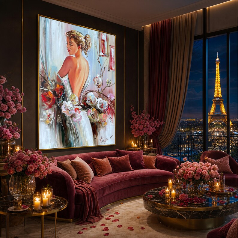 May include: An oil painting of a woman in a white dress with floral accents, displayed in a luxurious living room. The room features a curved red sofa, candles, and a view of the Eiffel Tower at night. The artwork is framed in gold.