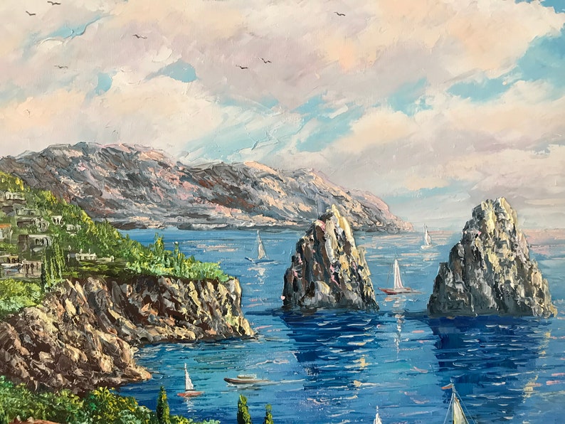 May include: A painting of a seascape with a rocky coastline, blue water, and white sailboats. The sky is a light blue with white clouds.