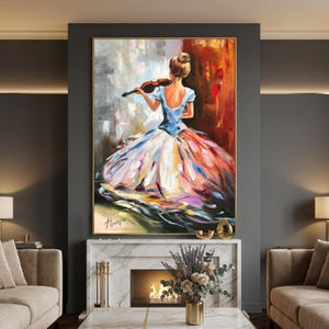 May include: An oil painting shows a woman playing a violin, seen from behind. She wears a blue dress with a full skirt in pink, orange, and white. The background has abstract brushstrokes in grey, red, and white, framed in gold.