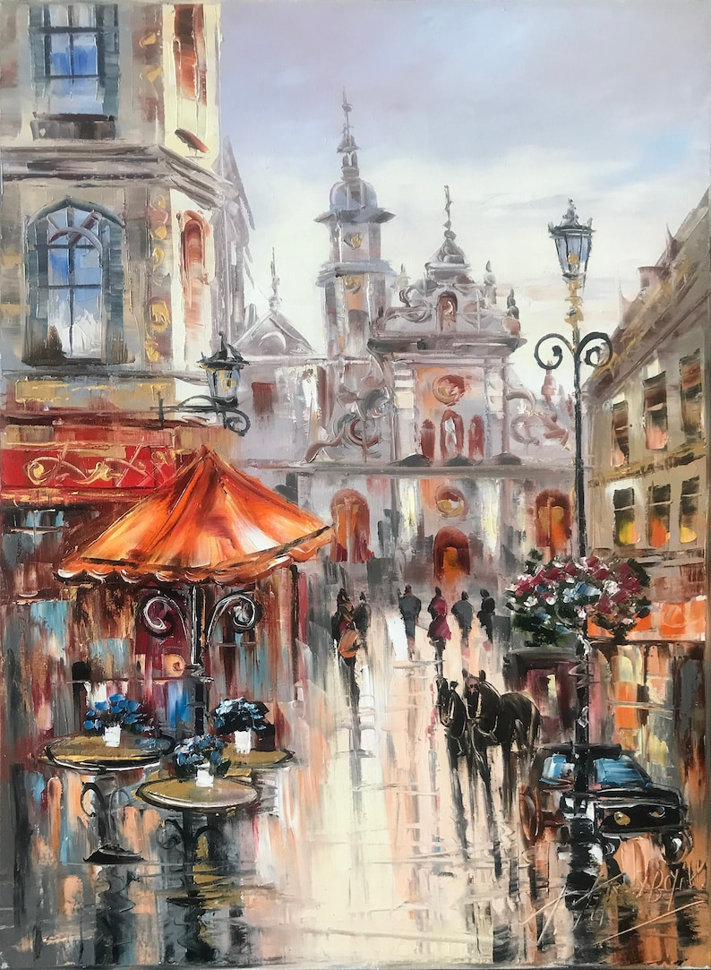 May include: A painting of a European city street scene with a horse-drawn carriage, a cafe with orange umbrellas, and a large building with a clock tower in the background.