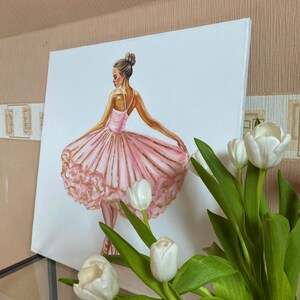 May include: A painting of a ballerina wearing a pink tutu with gold accents. The ballerina is standing on one leg with her other leg extended behind her. The background is white.