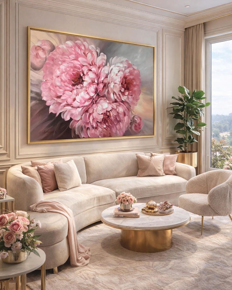 May include: An elegant living room with a large framed painting of pink peonies. A curved beige sofa with pink cushions, a round marble coffee table, and a cosy armchair create a sophisticated atmosphere. A potted plant and a window with a view enhance the room's appeal.