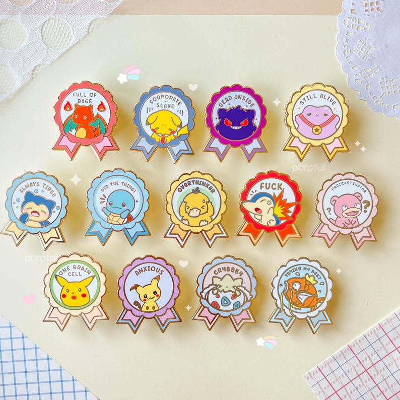 May include: A set of 14 enamel pins featuring various Pokemon characters with humorous phrases like "Always Tired", "Full of Rage", "Corporate Slave", "Dead Inside", "Still Alive", "Did the Thing", "Overthinker", "Fuck", "Procrastination", "One Brain Cell", "Anxious", "Crybaby", "Trying My Best", and "Procrastination".