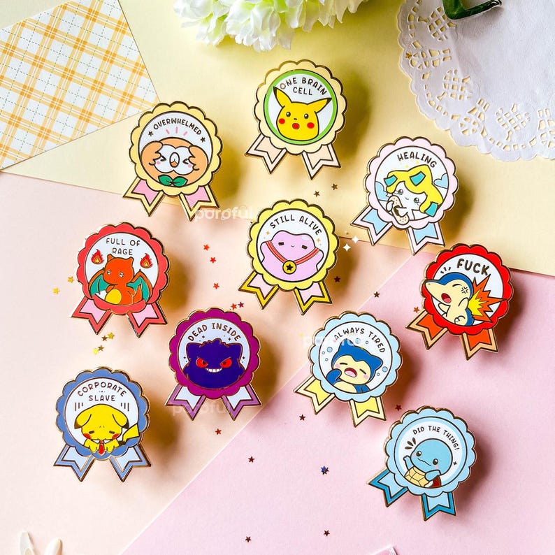 May include: Ten enamel pins featuring Pokemon characters with humorous phrases like "One Brain Cell", "Full of Rage", "Dead Inside", "Always Tired", "Did the Thing", "Healing", "Still Alive", "Overwhelmed", "Corporate Slave", and "F*ck".