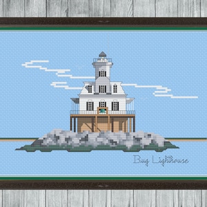 May include: A cross-stitch pattern of a white lighthouse on a rocky island with a blue sky and white clouds. The text "Bug Lighthouse" is below the lighthouse.