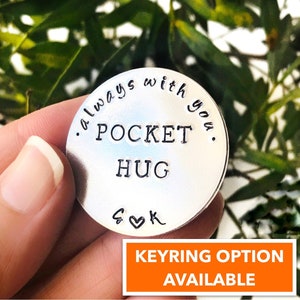 May include: Silver pocket hug keychain with the text "Always with you. Pocket Hug. S&K" engraved on it. Keyring option available.