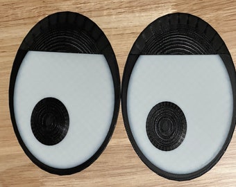 Occhi giganti e divertenti: decorazioni originali per bidoni della spazzatura, frigoriferi, porte