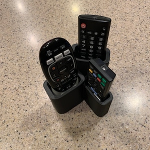 Remote holder/caddy/organizer for 3 remotes, one chubby compartment for DirecTV remotes.