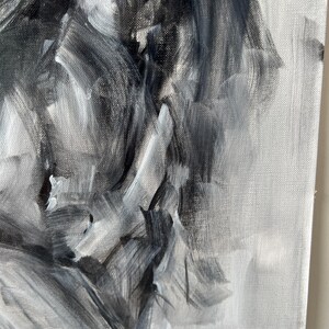 May include: Abstract oil painting on canvas, featuring a grayscale palette of black, white, and gray brushstrokes. The artwork showcases expressive, textured strokes, creating a dynamic and emotional visual experience. The canvas is stretched and ready to hang.