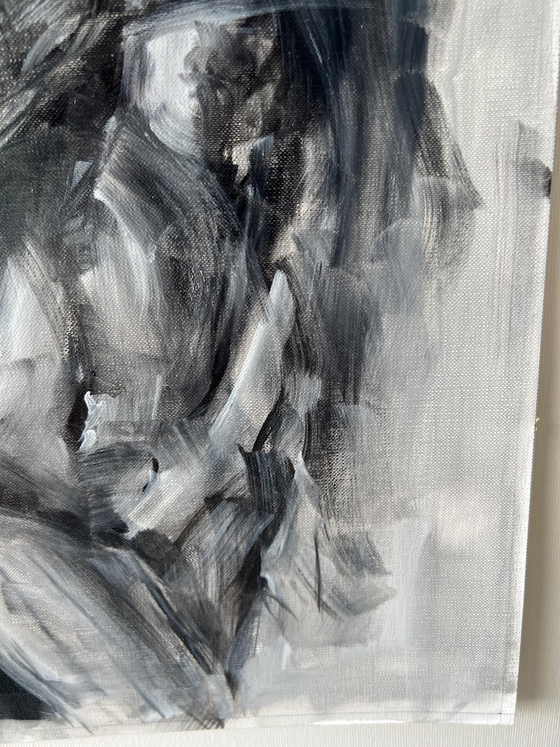 May include: Abstract oil painting on canvas, featuring a grayscale palette of black, white, and gray brushstrokes. The artwork showcases expressive, textured strokes, creating a dynamic and emotional visual experience. The canvas is stretched and ready to hang.