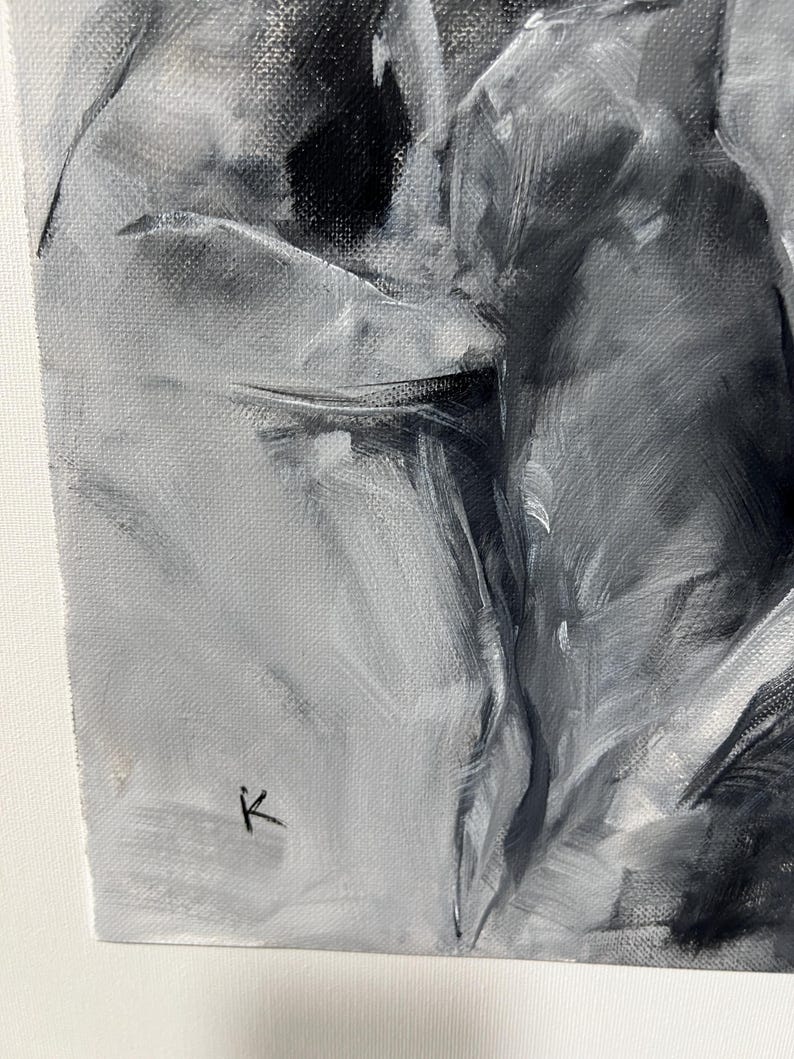 May include: A grayscale abstract painting on canvas. The artwork features a blend of black, white, and gray brushstrokes, creating a textured and dynamic composition. The artist's signature, a small "K", is visible in the lower left corner.