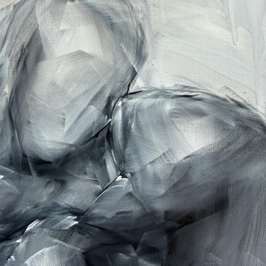 May include: An abstract oil painting on canvas featuring two figures in an embrace, rendered in monochromatic shades of charcoal, slate gray, and white. The composition utilizes broad, visible brushstrokes to create depth and texture.