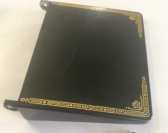 A vintage folding bed extension for a singer featherweight model 221
