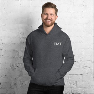May include: A dark gray hooded sweatshirt with the word "EMT" embroidered on the left chest.