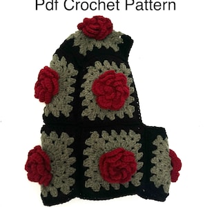 May include: A black, gray, and red crochet pattern. The pattern is for a hood with square granny stitch panels. The hood is decorated with red crochet roses. The text "Pdf Crochet Pattern" is at the top.