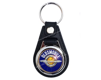 Oldsmobile round key ring / fob.