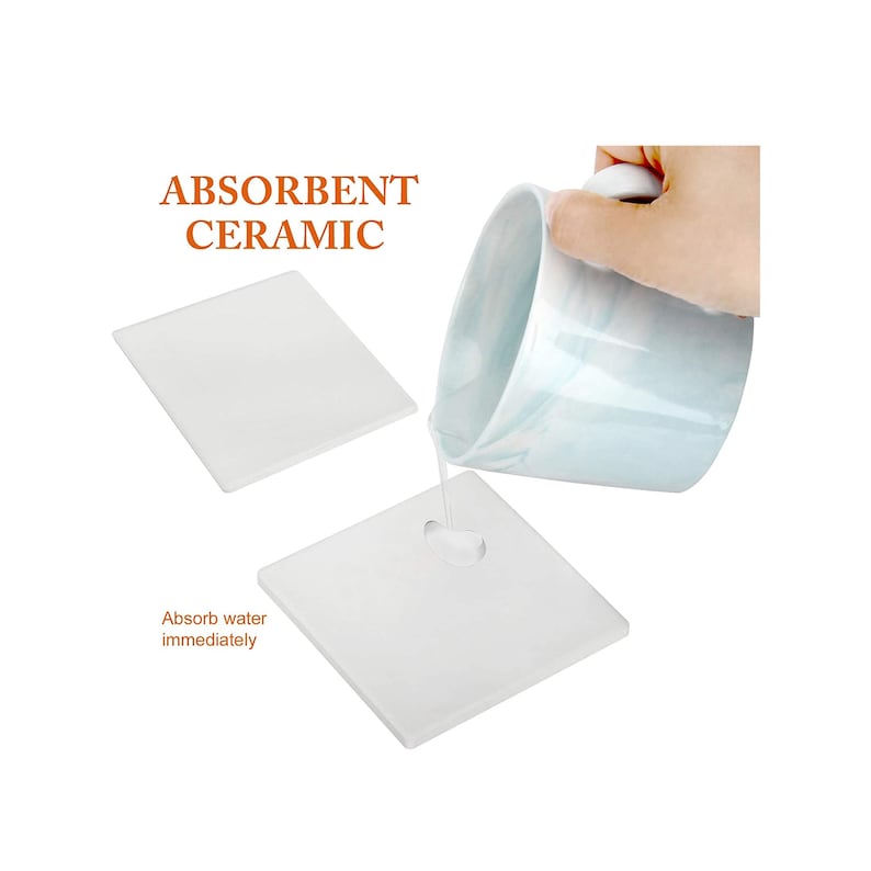 May include: Two white ceramic coasters with the text "ABSORBENT CERAMIC" and "Absorb water immediately" printed on them. A hand is pouring water from a white ceramic cup onto one of the coasters.