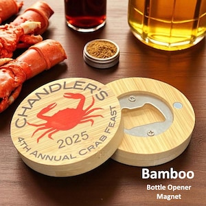 May include: A round bamboo bottle opener magnet with a crab design. The opener has the text "Chandler's 4th Annual Crab Feast 2025". The bottle opener is made of bamboo and has a silver bottle opener insert.