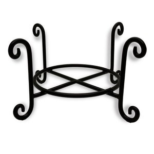 May include: Black metal plant stand with a round base and four curled legs.