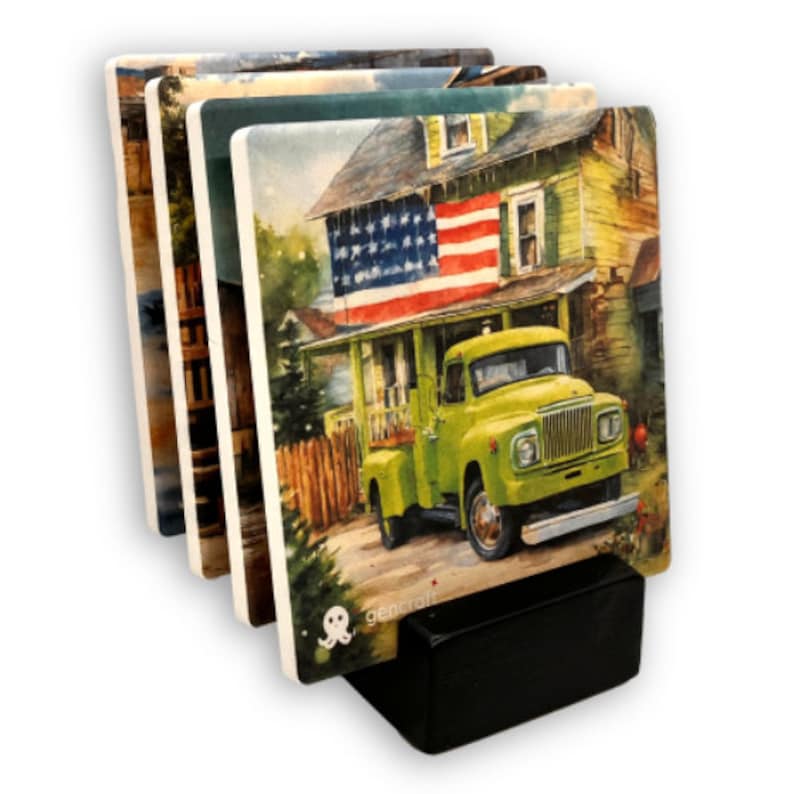 May include: Set of four ceramic coasters with watercolor images of a house with an American flag, a green truck, and other landscape scenes. The coasters are displayed in a black holder. The brand name "gencraft" is visible on the bottom of the coasters.