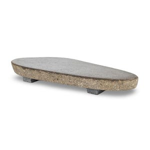 May include: A gray, oval-shaped serving board with a textured surface, supported by two rectangular, gray feet. The board has a natural, light brown edge. This decorative piece is ideal for serving appetizers or displaying items.