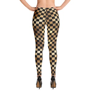 Hotwife Leggings - gold and black checkerboard design with hotwife motif in gold subtly hidden in checkerboard. Ideal gift for hotwife.