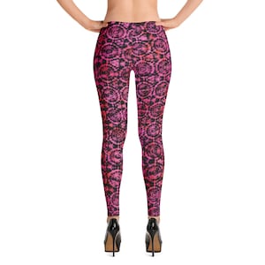 May include: Pink and black leggings with a tie-dye pattern. The leggings are made of a stretchy, comfortable fabric and are perfect for yoga, running, or everyday wear.