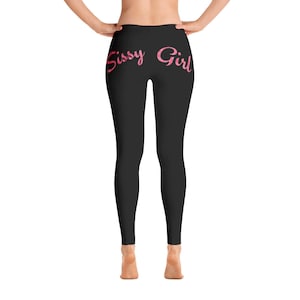 May include: Black leggings with the words "Sissy Girl" printed in pink on the back.