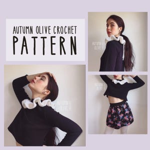 May include: The image showcases a crochet pattern titled "Autumn Olive Crochet Pattern." The design features a white, ruffled crochet collar paired with a black top. The overall aesthetic is a blend of handmade craft and fashion.
