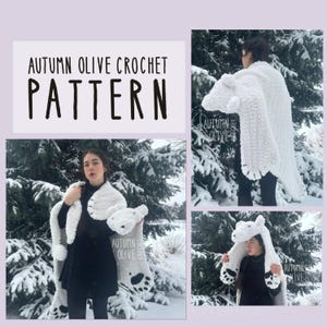 May include: A white crochet polar bear blanket with a hood. The blanket is worn by a person in a snowy winter scene. The text "Autumn Olive Crochet" is visible on the blanket.