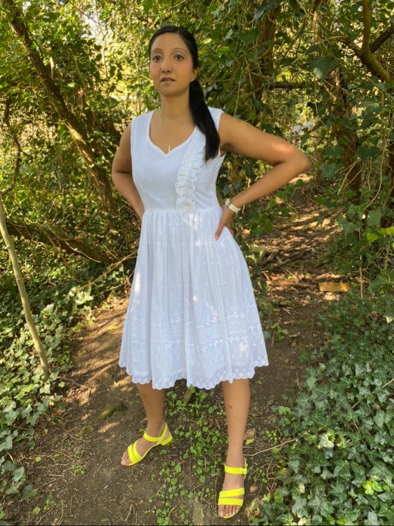 Knee length white dress top