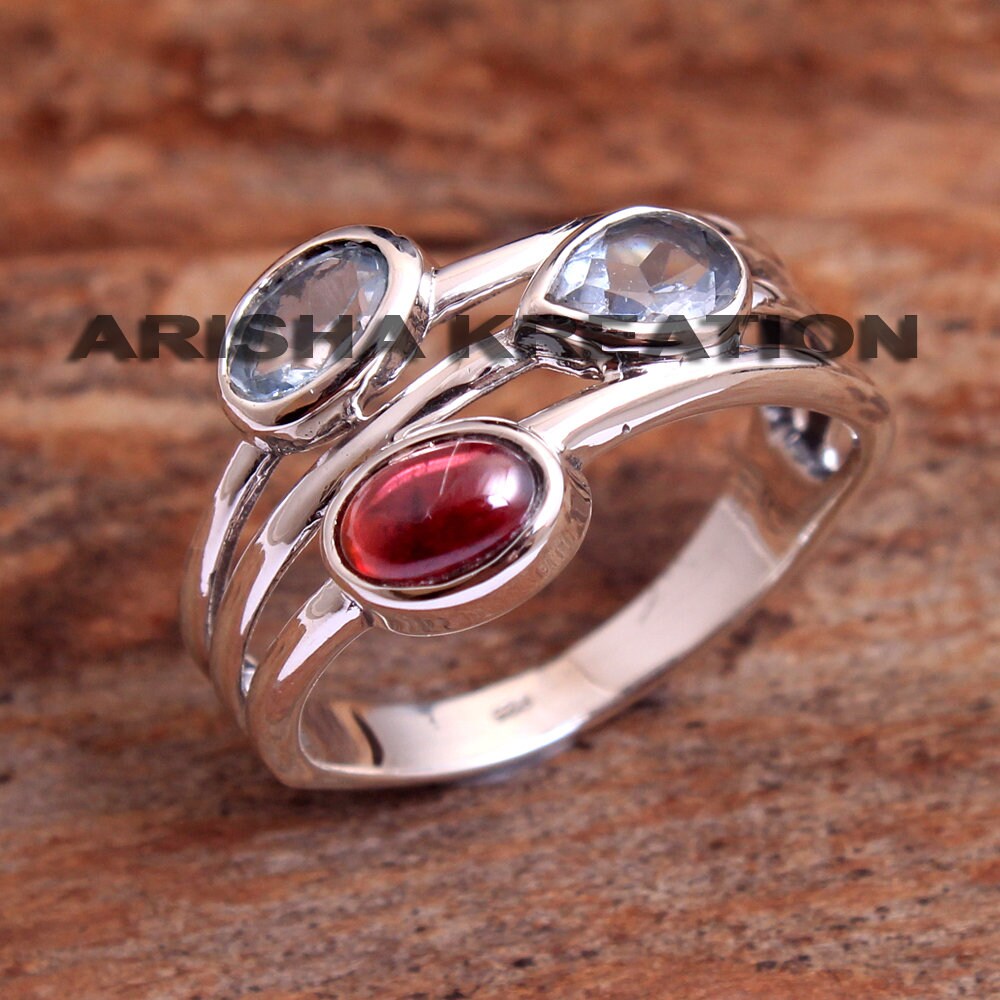 Garnet and blue topaz ring deals