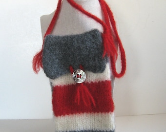 May include: A small knitted bag with a red, white, and gray striped pattern. The bag has a gray flap with a silver button and a red tassel. The bag has a long red strap.
