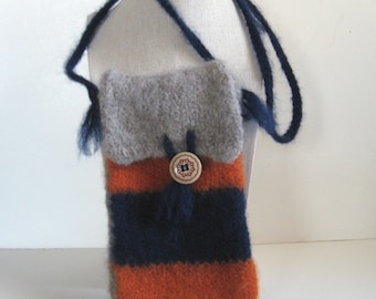 May include: A handmade, wool crossbody bag with a flap closure. The bag features horizontal stripes in orange and navy blue, with a gray top and a decorative button. The strap is navy blue.
