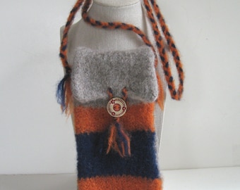 May include: A small, striped knitted bag with a gray flap and a round button. The bag has a long strap and is made of orange, blue, and gray yarn.