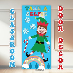 May include: A blue classroom door decoration with an elf design and the text "TAKE A SELFIE". The elf has a face cutout, green outfit, and candy canes. The words "CLASSROOM" and "DOOR DECOR" are also displayed.