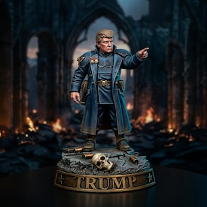 May include: A painted miniature figurine of a man with blonde hair wearing a long dark blue military-style coat with medals, pointing forward. The figure stands on a rocky base with a skull and shell casings, featuring the name TRUMP in gold letters.