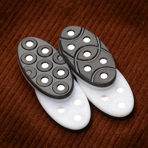 Double-Sided Magnetic Fidget Slider: Black & White Oval. Solid milled polyacetal.