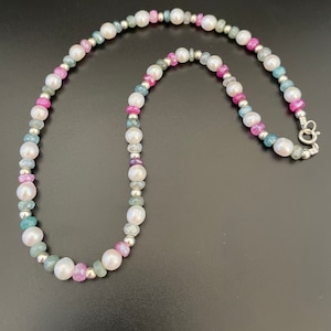 5.5/6mm high quality Freshwater pearls with 4/5mm faceted silverite beads and 4mm sterling beads. Measures 17 inches.