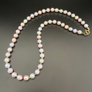 5.5/6mm high quality Freshwater pearls with multi colored 2mm seed beads.