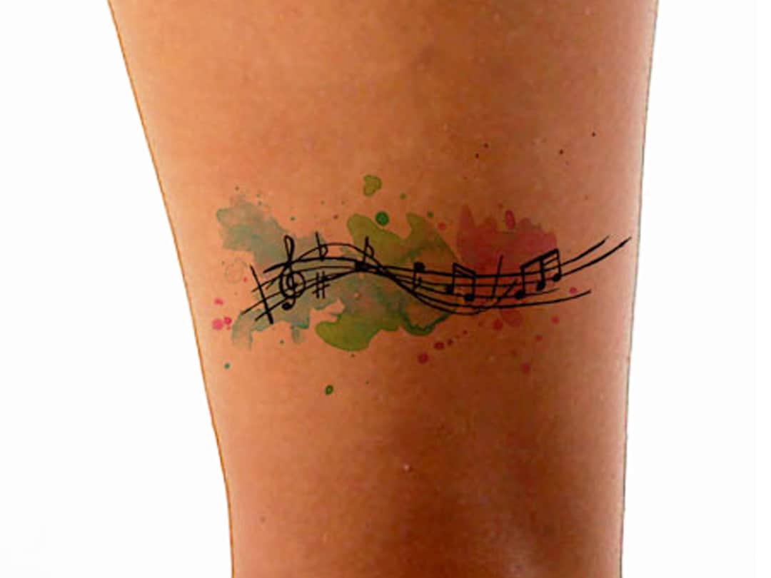 Star and Music Notes Tattoo Idea