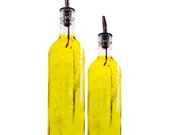Hand etched butterfly wrapped olive oil pourer with stainless steel spout.