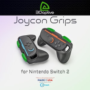 May include: Two black Joycon grips for Nintendo Switch 2, with green and orange accents. The text "Joycon Grips" and "for Nintendo Switch 2" are displayed. The product is 3D printed and made in the USA.