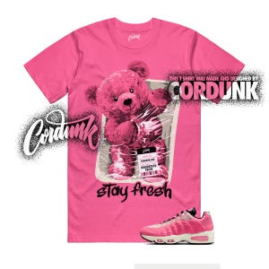 May include: A pink t-shirt with a graphic of a pink teddy bear in plastic wrap, with the text "stay fresh". A pink and white sneaker is at the bottom. The brand name "Cordunk" is displayed in a stylized font.