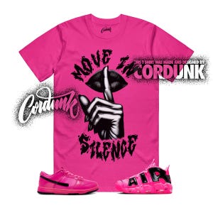 May include: A bright pink t-shirt with the words "MOVE IN SILENCE" and a graphic of a hand with a finger over lips. The shirt is paired with pink sneakers. The text "THIS T SHIRT WAS MADE AND DESIGNED BY CORDUNK" is also visible.