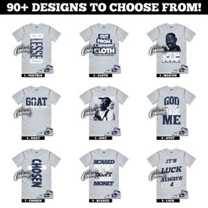 May include: A collection of nine light gray t-shirts with various designs and text. The shirts feature phrases like "BLESSED", "GOAT", and "CUT FROM A DIFFERENT CLOTH". Each shirt has a pair of sneakers at the bottom.
