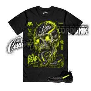 May include: Black t-shirt with a neon green skull graphic and the text "ELECTRIC DEAD". The design includes a pair of black sneakers with neon green accents. The shirt also has the text "VOLT-23".