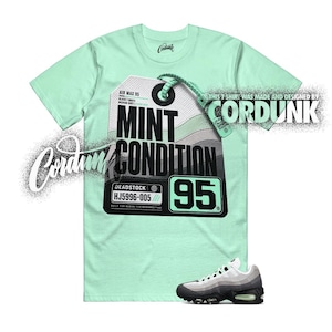 May include: A mint green short-sleeve t-shirt featuring a large graphic of a sneaker hang tag with the text "AIR MAX 95", "MINT CONDITION", "95", and "DEADSTOCK HJ5996-005". The shirt also displays the brand name "CORDUNK" in stylized text.